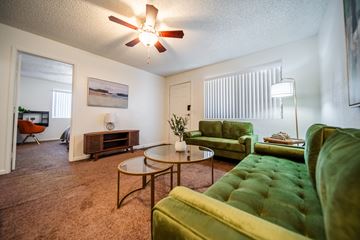 Flagstaff apartment for rent - A living room with a green couch and a coffee table.