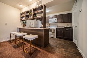 Flagstaff apartment for rent - A kitchen with a bar stool and a counter.