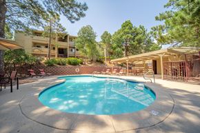 Flagstaff apartment for rent - A small round pool with a white fence around it.