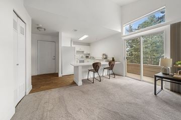 Flagstaff apartment for rent - A white kitchen with a dining table and chairs.
