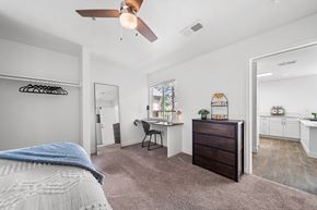 Flagstaff apartment for rent - A bedroom with a bed, desk, and chair.