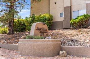 Cottonwood apartment for rent - A sign that says Sagewood Apartments 370 is in front of a building.