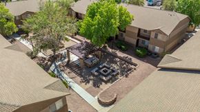 Cottonwood apartment for rent - A courtyard surrounded by buildings with a firepit in the middle.