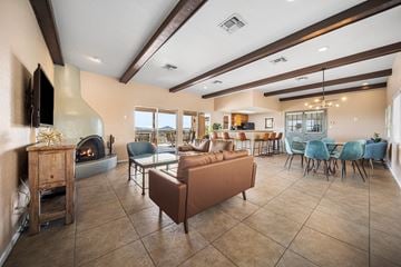 Tucson apartment for rent - A living room with a fireplace and a couch.