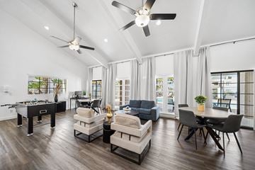Tucson apartment for rent - A spacious living room with a pool table and comfortable seating.