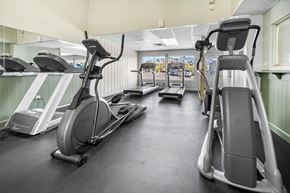 Tucson apartment for rent - A gym with treadmills and exercise equipment.