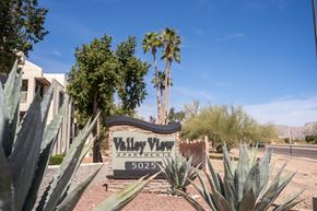 Tucson apartment for rent - A sign for Valley View Apartments is surrounded by desert plants.
