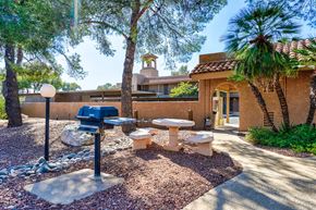 Tucson apartment for rent - BBQ grill and seating area at Altamira Apartments