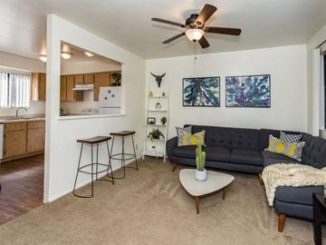 Flagstaff apartment for rent - a living room with a couch and a ceiling fan