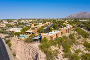 Tucson apartment for rent - A desert landscape with a road and buildings.
