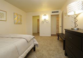 Sierra Vista apartment for rent - a bedroom with a bed and a dresser and a closet
