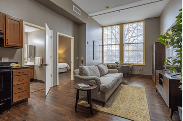 Cleveland apartment for rent - a living room with a couch and a table in front of a window