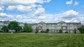 Walkersville apartment for rent - A large grassy field in front of apartment buildings.
