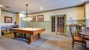 Walkersville apartment for rent - A room with a pool table and a chair.