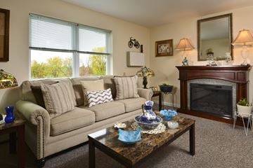 Troy apartment for rent - a living room with a couch and a fireplace