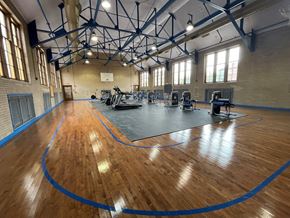 Cleveland apartment for rent - a gym with a hard wood floor and gym equipment