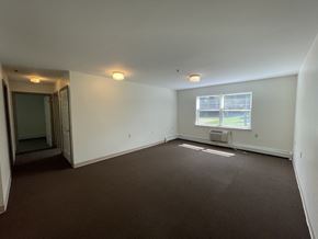 Guilderland apartment for rent - an empty living room with white walls and a window