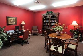 Waldorf apartment for rent - a room with a table and chairs and a bookcase