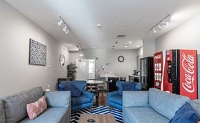 Hartford apartment for rent - A living room with a Coca-Cola vending machine.