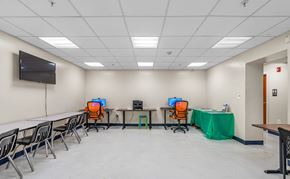 Washington apartment for rent - Community room with workstations and seating area  at The Village at Chesapeake Apartments, Washington