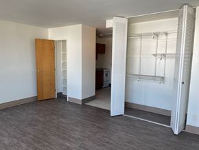 Mayfield Heights apartment for rent - A room with a wooden door and a white wall.