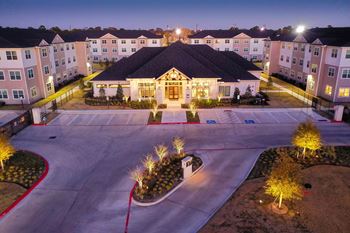 A large building with a courtyard in front of it