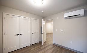 Mechanicville apartment for rent - A room with a row of white cupboards and a white wall at Hudson Heights Apartments, Mechanicville, NY