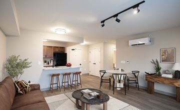 Mechanicville apartment for rent - A living room with a brown couch and a coffee table.