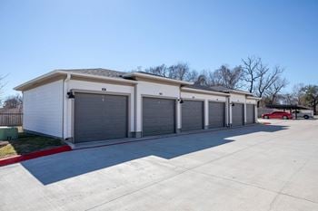 A row of garage doors on the side of a building