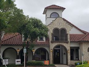 San Antonio apartment for rent - Spanish style building with stone facade and tower at Palo Alto Apartments Homes, San Antonio
