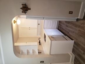 Tacoma apartment for rent - a kitchen with a refrigerator and a stove and a sink