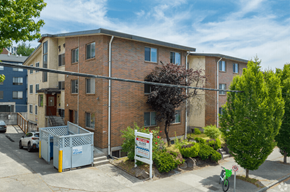 Seattle apartment for rent - A building with a sign in front of it.