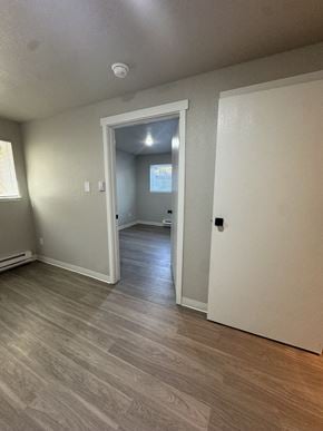 Seattle apartment for rent - A room with a doorway leading to another room.