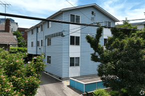 Seattle apartment for rent - A blue house with a hot tub in front.