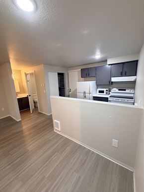 Seattle apartment for rent - A kitchen area with a stove, oven, and microwave.