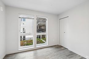 Seattle apartment for rent - A room with a view of a building through the window.