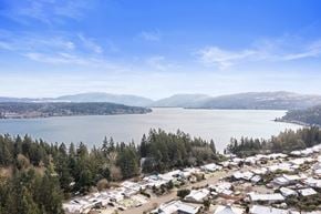 Bellevue apartment for rent - a city with a lake and mountains in the background