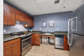 Bellevue apartment for rent - a kitchen with wooden cabinets and stainless steel appliances
