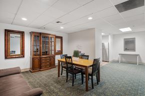 Bellevue apartment for rent - a conference room with a table and chairs and a couch