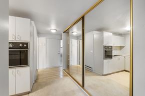 Bellevue apartment for rent - a renovated kitchen with white cabinets and stainless steel appliances