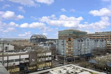Seattle apartment for rent - A cityscape with buildings and a clear sky.