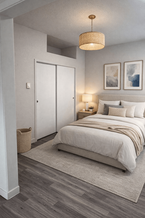 Olympia apartment for rent - A bedroom with a bed, two lamps, and two pictures on the wall.
