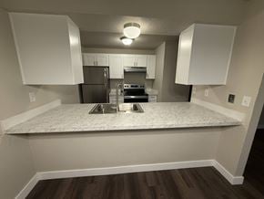 Tacoma apartment for rent - A kitchen with a refrigerator, stove, and oven.