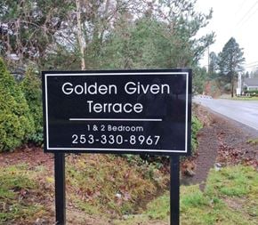 Tacoma apartment for rent - A sign for Golden Given Terrace with a phone number for a 1 and 2 bedroom option.