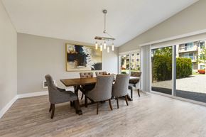 Everett apartment for rent - A dining room with a wooden table and chairs.