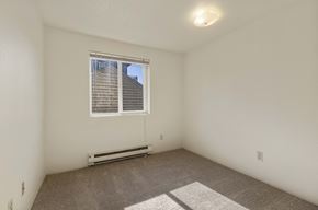 Seattle apartment for rent - A room with a window and a carpeted floor.