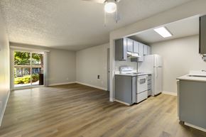 Everett apartment for rent - A kitchen area with a refrigerator, oven, and microwave.