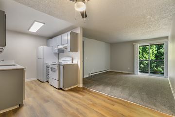 Everett apartment for rent - A kitchen with a refrigerator, microwave, and oven.