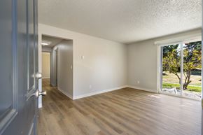 Everett apartment for rent - A room with a wooden floor and white walls.