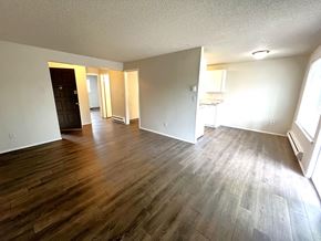 Lakewood apartment for rent - A room with wooden flooring and white walls.